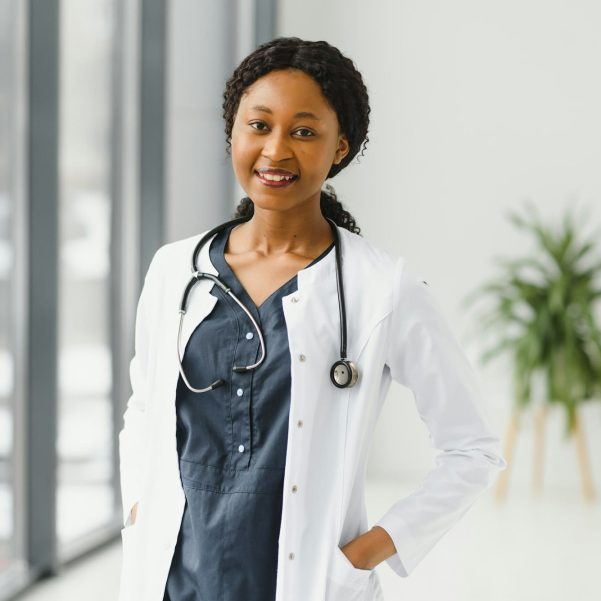 portrait of african female doctor at workplace.