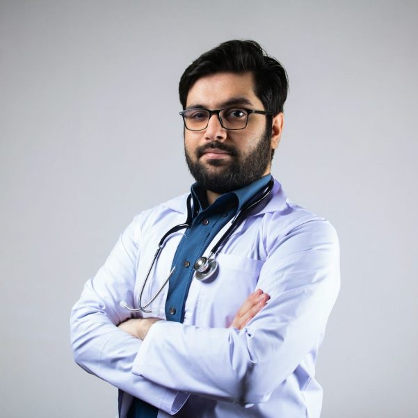 man in white dress shirt wearing black framed eyeglasses